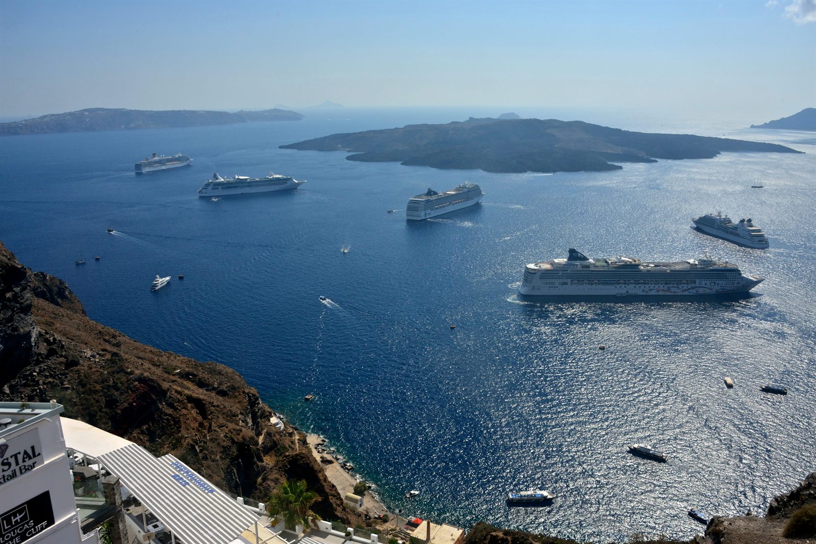 Cruise ships anchored in a caldera bay