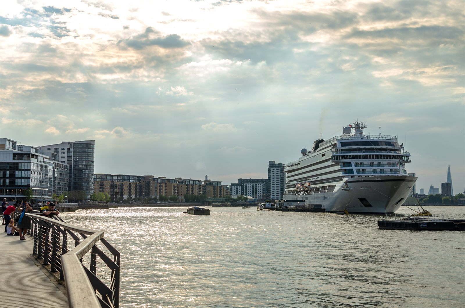 Cruise ship docked at a city waterfront